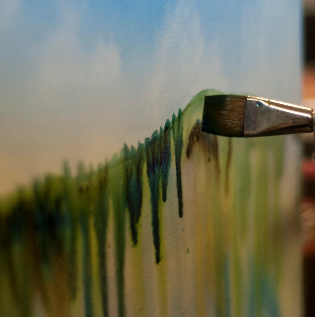 Agnieszka Orleańska - Ilustracje Close-up of a watercolor painting being created on canvas, showcasing artistic creativity.